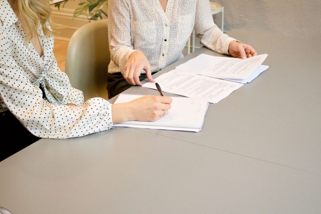Two people signing an energy contract