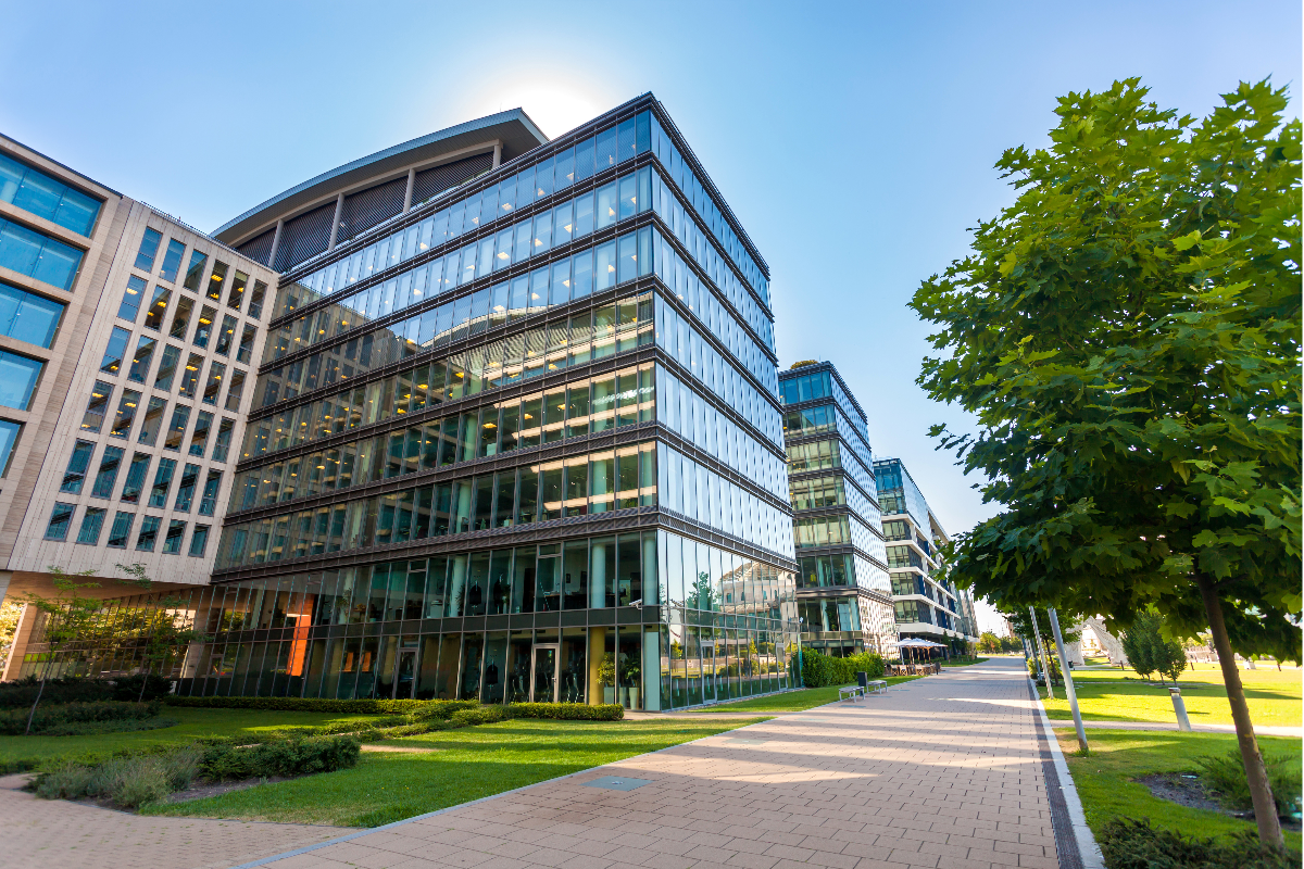 An outside view of an office property surrounded by trees