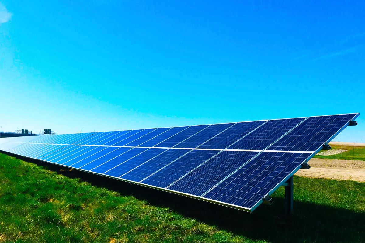 A line of solar panels generating net zero emissions electricity