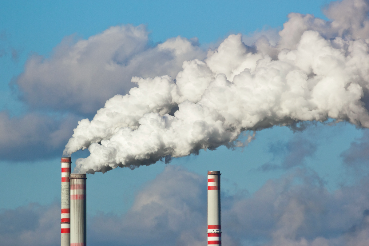 Carbon emissions and smoke from a pipe